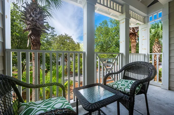 a view of a chairs and table in the patio