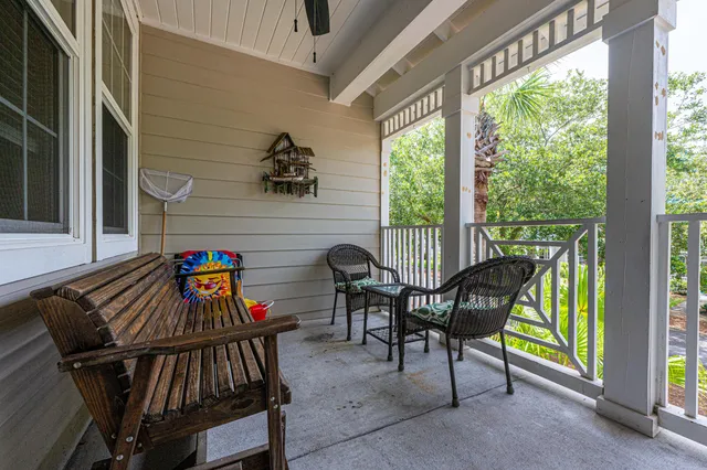a view of a patio with a table and chairs in the balcony