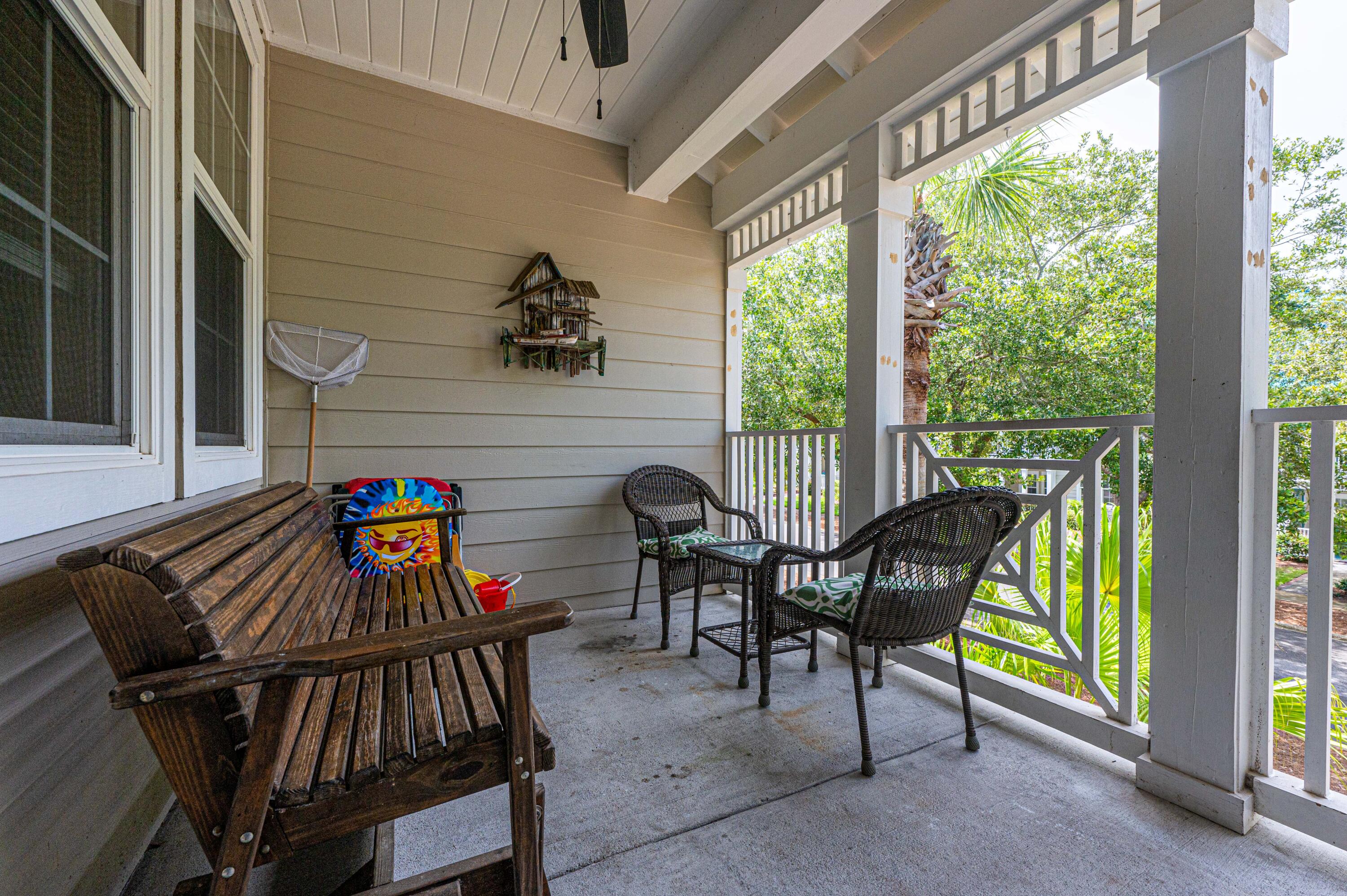 104 Village Boulevard, Unit 621 Santa Rosa Beach, FL 32459 - Photo 33 of 49 a view of a patio with a table and chairs in the balcony