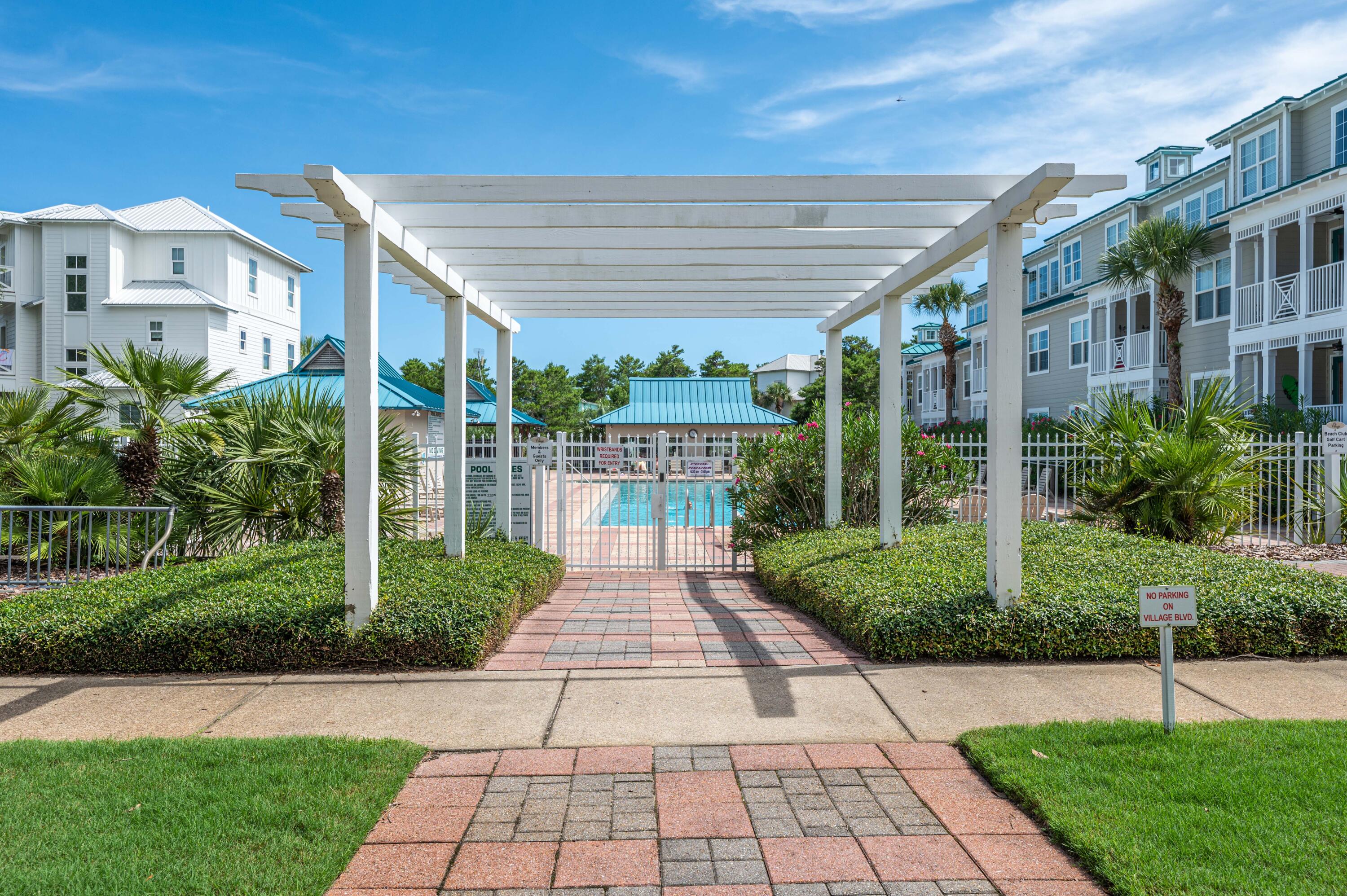 104 Village Boulevard, Unit 621 Santa Rosa Beach, FL 32459 - Photo 35 of 49 a view of a brick house with a yard