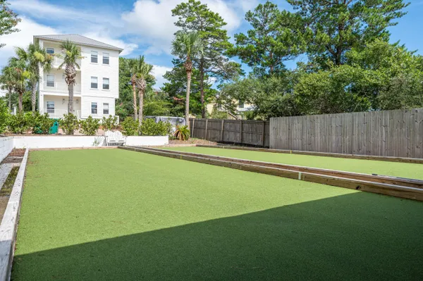 a swimming pool with outdoor seating and yard