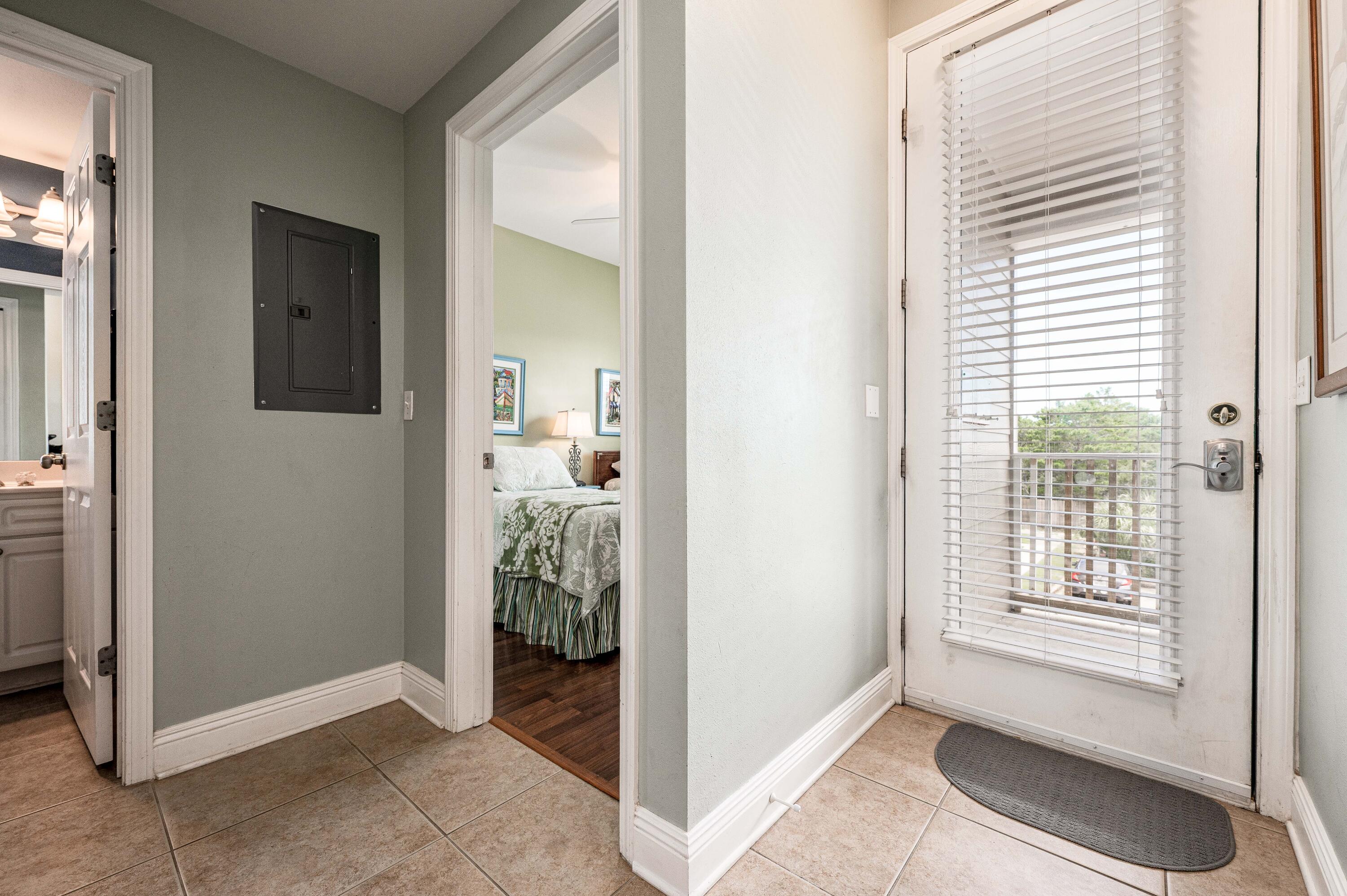 104 Village Boulevard, Unit 621 Santa Rosa Beach, FL 32459 - Photo 10 of 49 a view of a livingroom with bathroom and front door