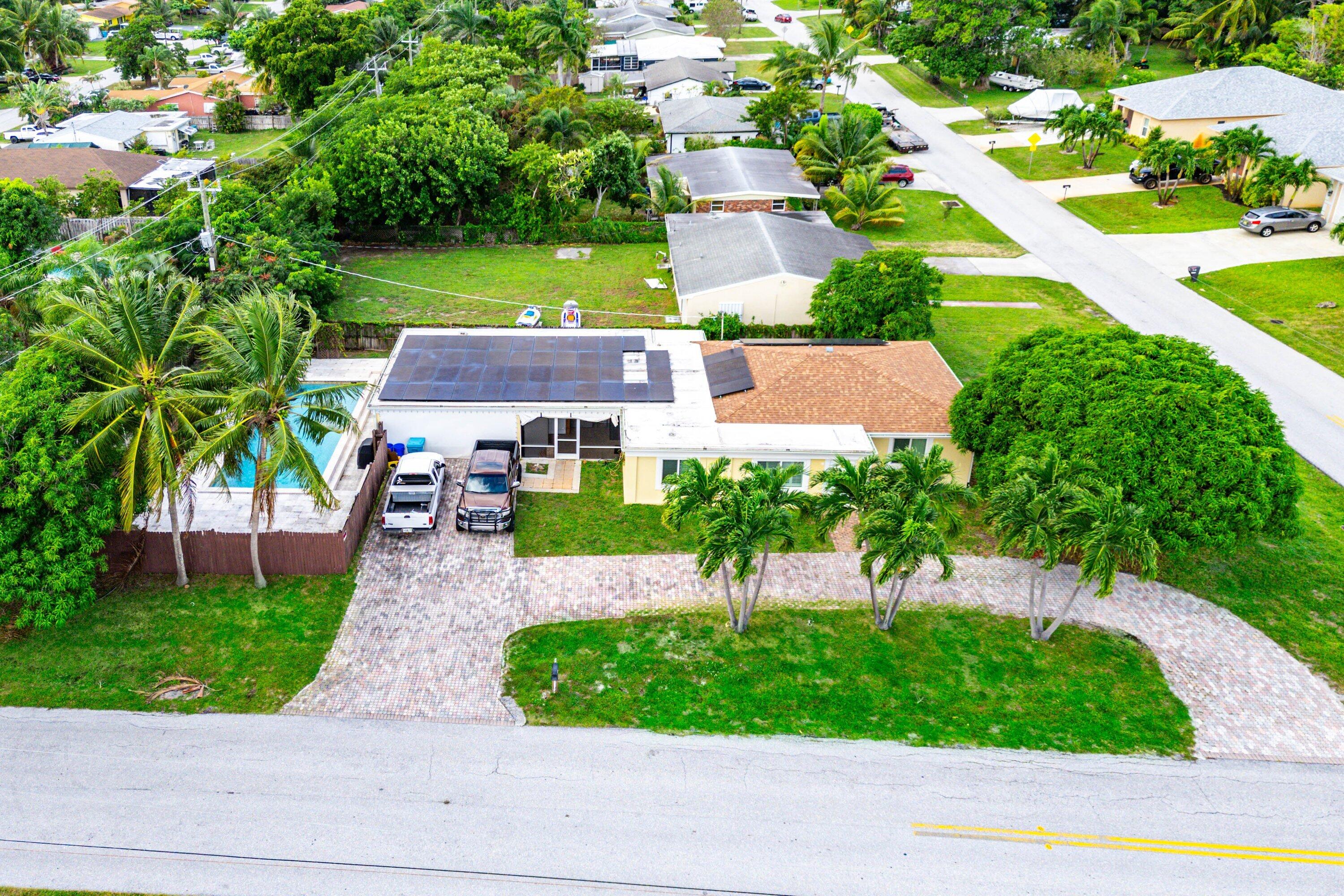 305 Southwest 3rd Street Boynton Beach, FL 33435 - Photo 1 of 36 a aerial view of a house with garden