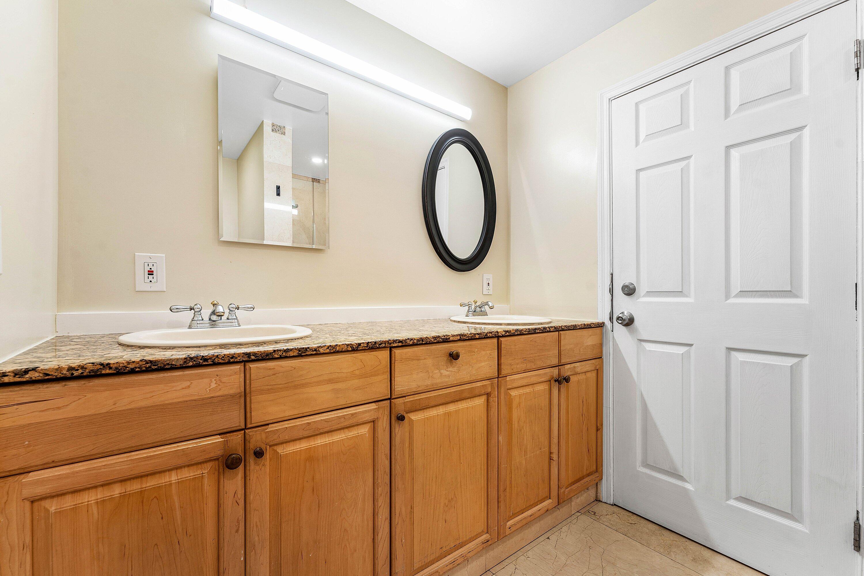 305 Southwest 3rd Street Boynton Beach, FL 33435 - Photo 18 of 36 a bathroom with a granite countertop double vanity sink and a mirror