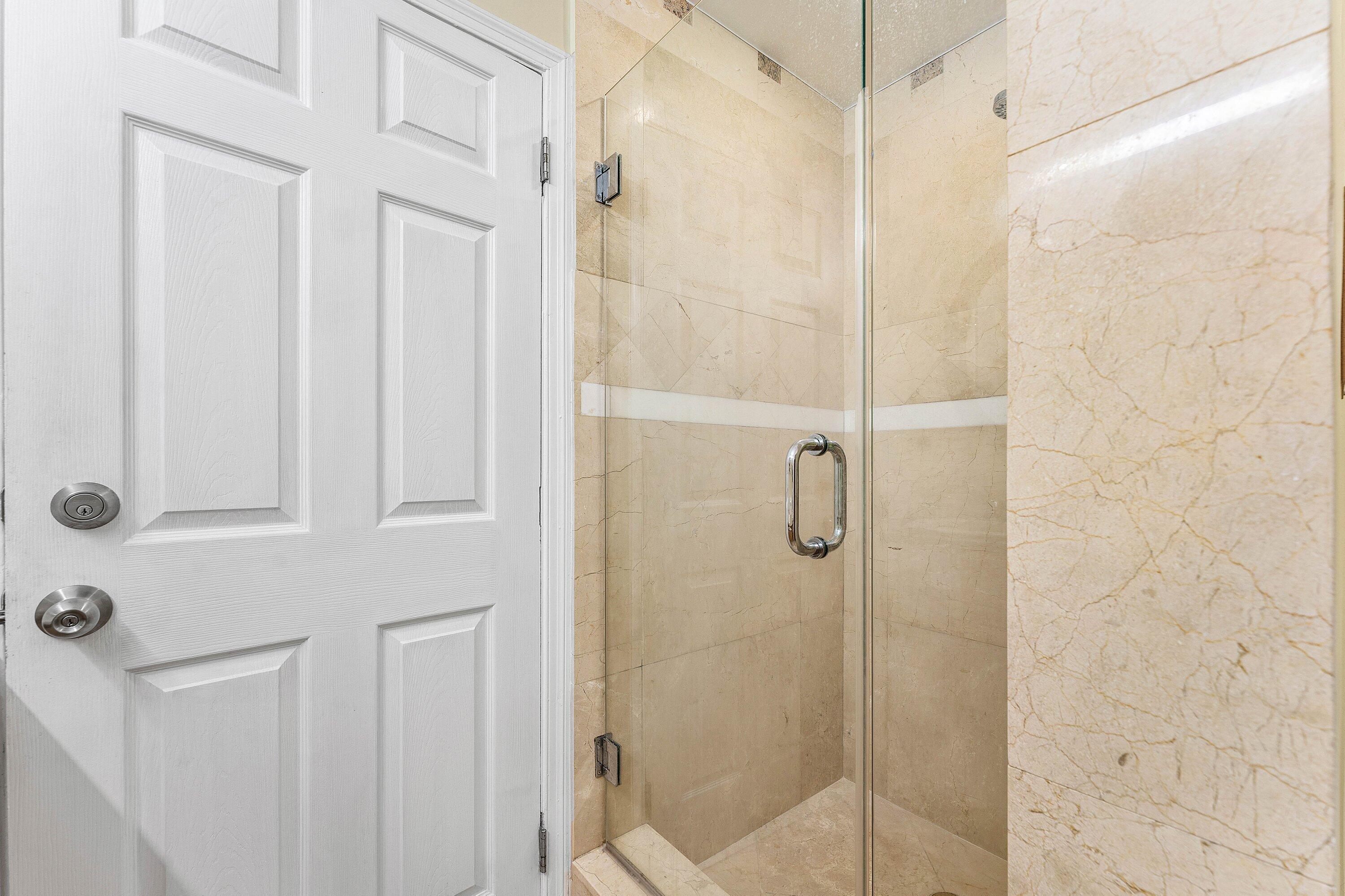 305 Southwest 3rd Street Boynton Beach, FL 33435 - Photo 19 of 36 a bathroom with a shower