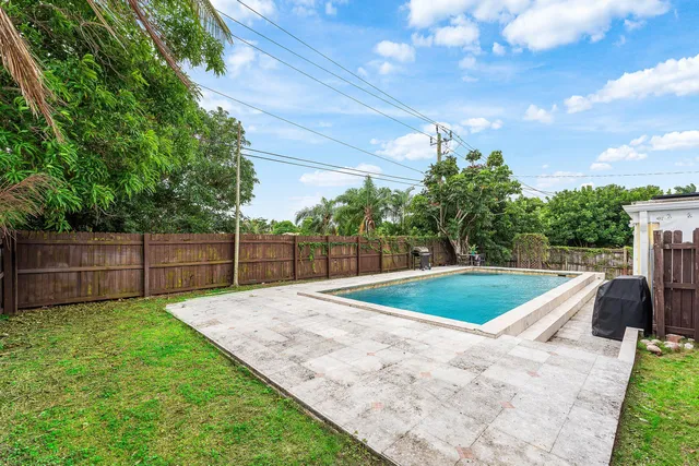 a view of outdoor space and backyard