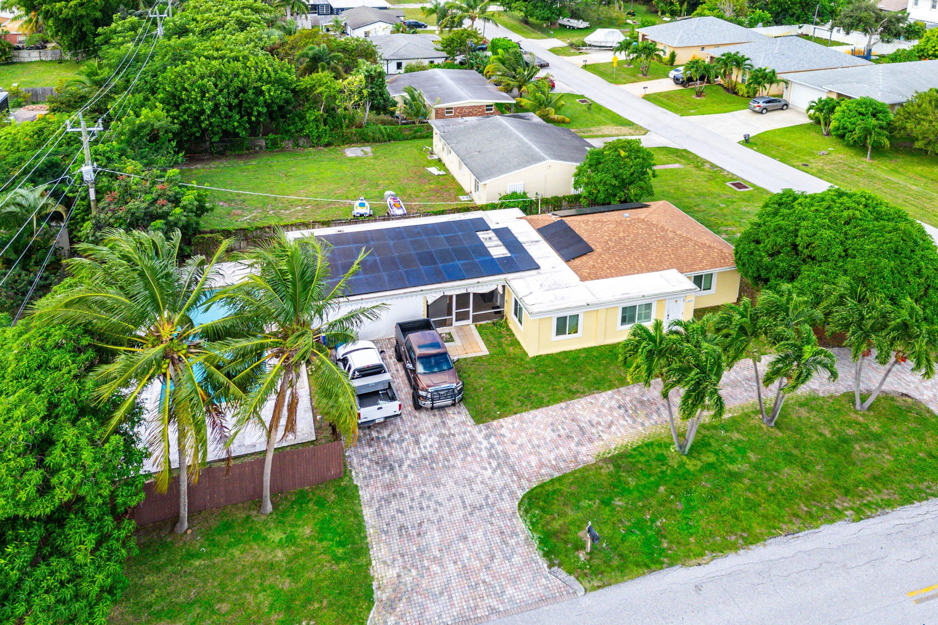 305 Southwest 3rd Street Boynton Beach, FL 33435 - Photo 30 of 36 an aerial view of a house with a garden