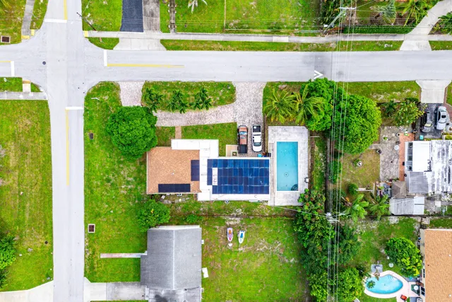an aerial view of a house with a garden