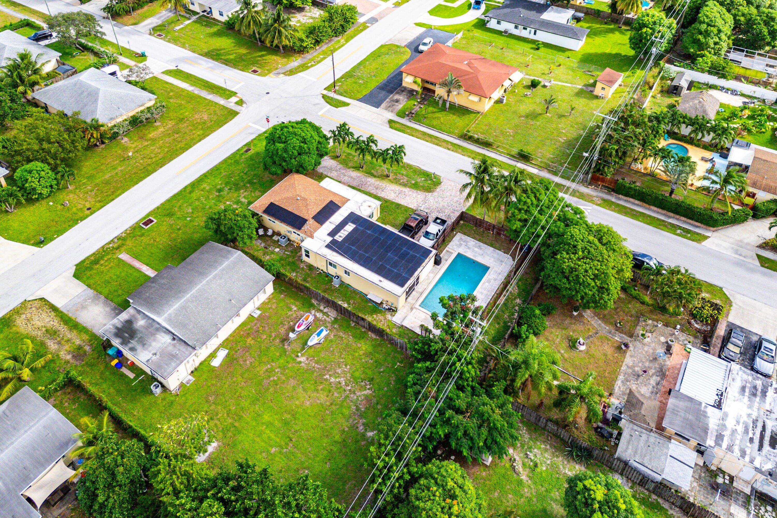 305 Southwest 3rd Street Boynton Beach, FL 33435 - Photo 33 of 36 an aerial view of a house with a garden