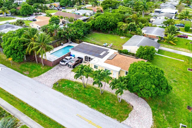 an aerial view of a house with a garden