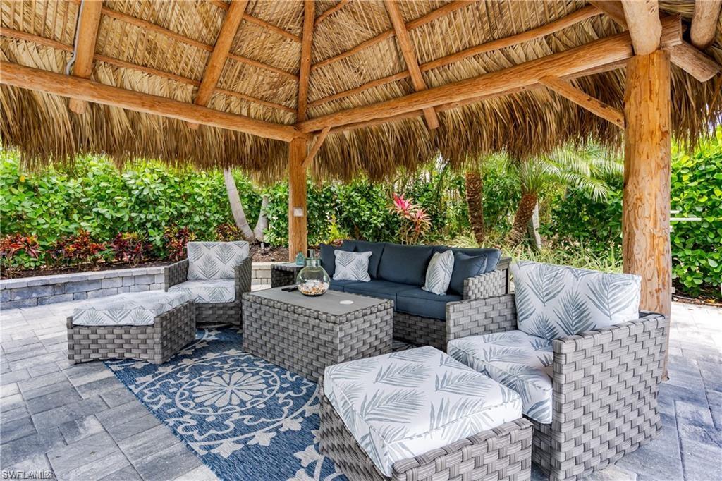 13526 Snook Circle Naples, FL 34114 - Photo 11 of 36 a view of patio with couches and potted plants