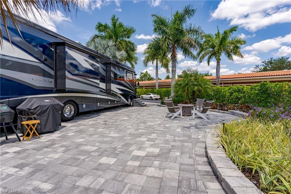 13526 Snook Circle Naples, FL 34114 - Photo 13 of 36 a view of swimming pool with outdoor seating