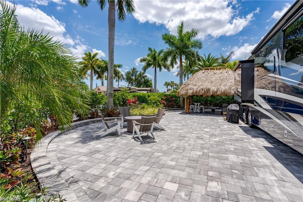 13526 Snook Circle Naples, FL 34114 - Photo 16 of 36 a view of a backyard with sitting area