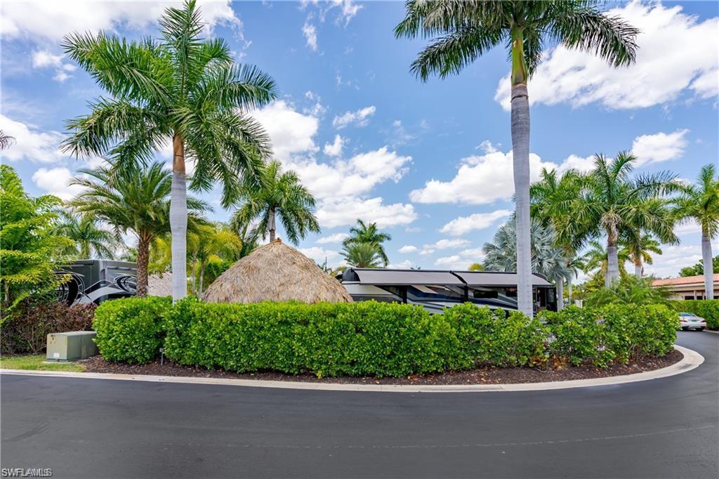 13526 Snook Circle Naples, FL 34114 - Photo 20 of 36 a view of a garden with a house