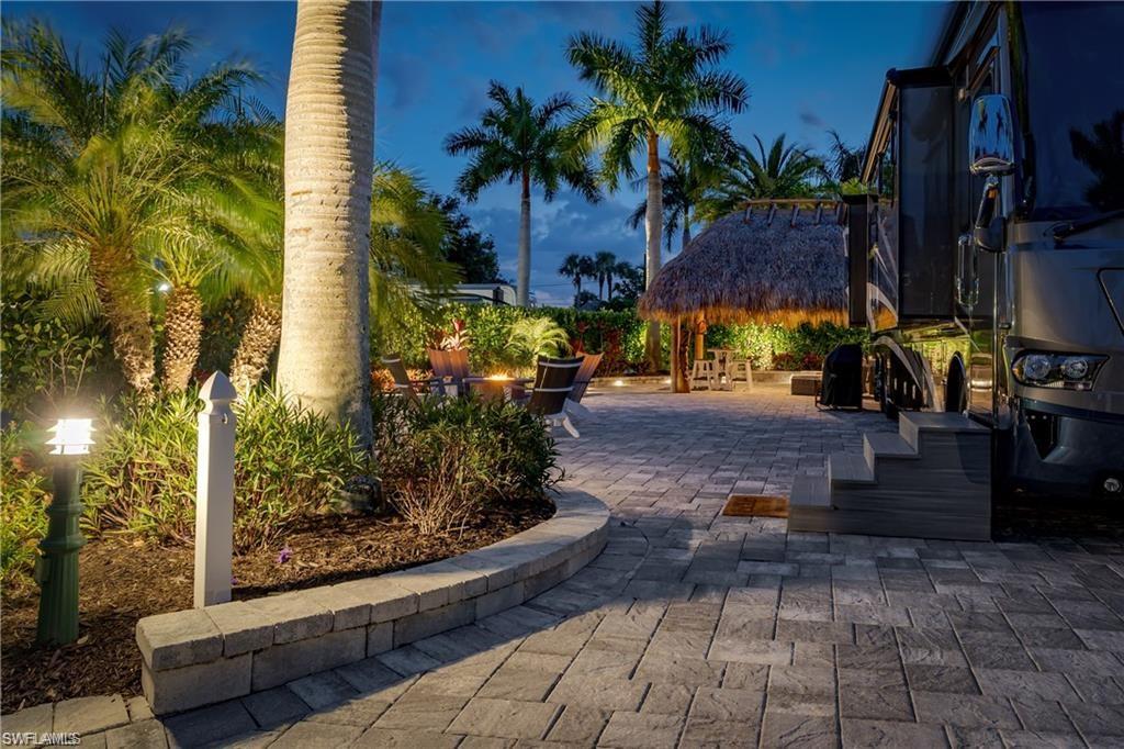 13526 Snook Circle Naples, FL 34114 - Photo 21 of 36 a view of a yard with plants and trees