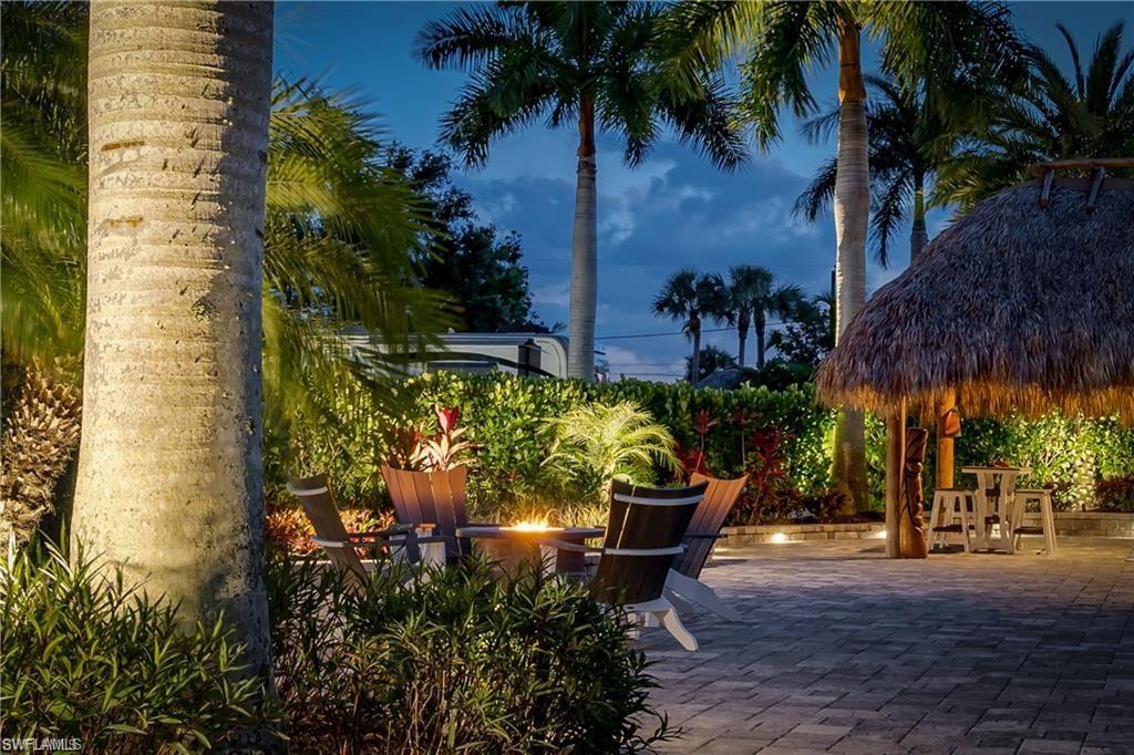 13526 Snook Circle Naples, FL 34114 - Photo 22 of 36 a view of an outdoor sitting area with golf course
