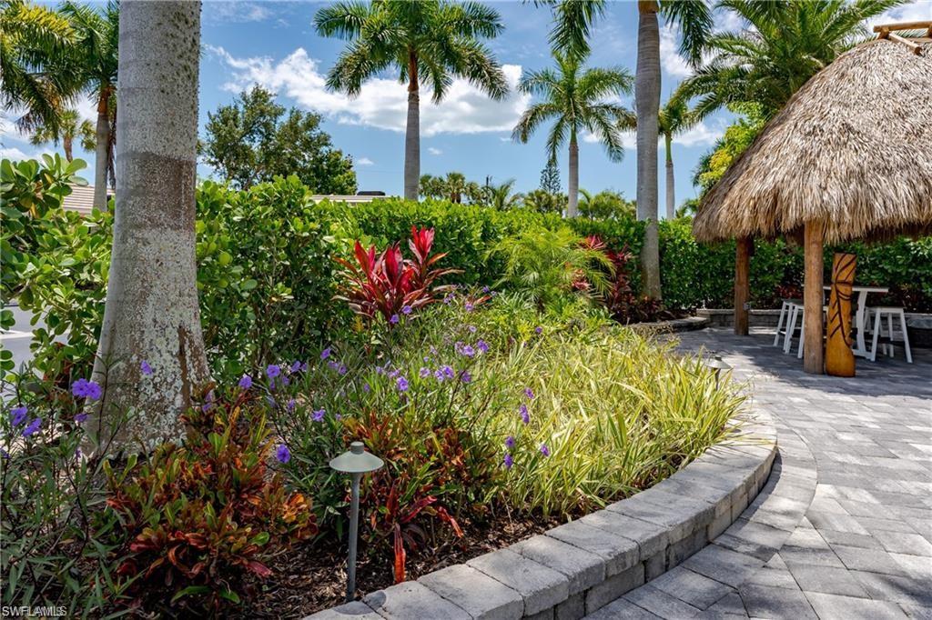 13526 Snook Circle Naples, FL 34114 - Photo 4 of 36 a view of a backyard with plants