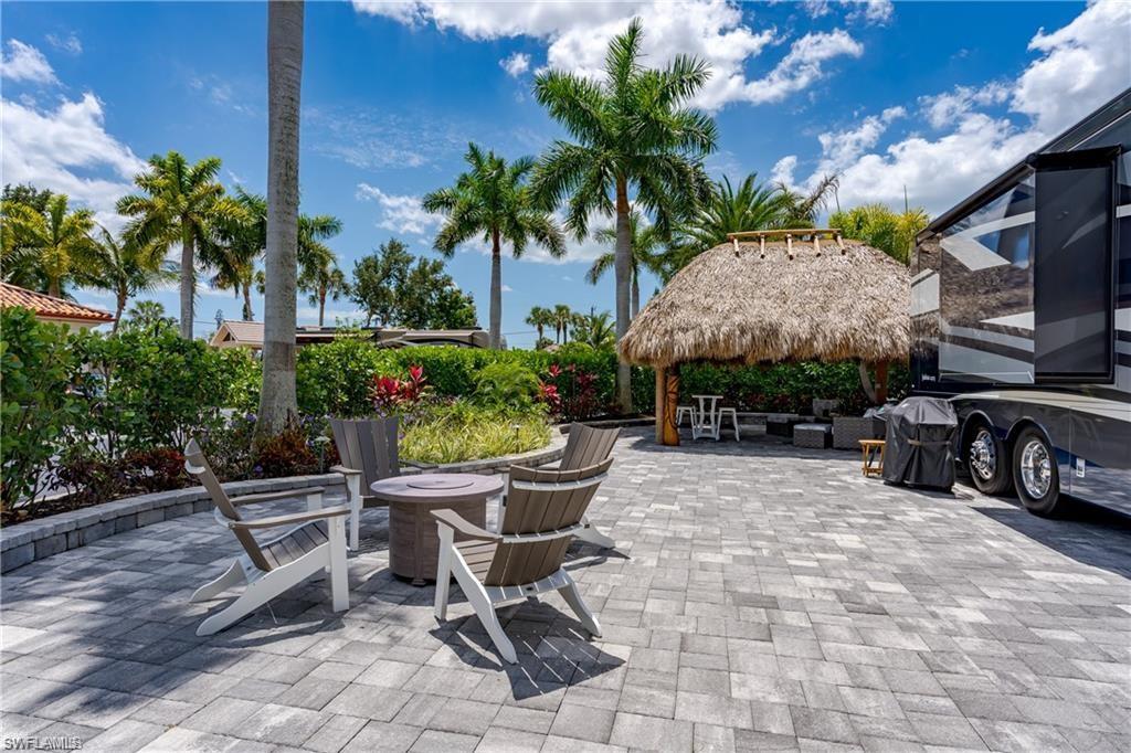13526 Snook Circle Naples, FL 34114 - Photo 5 of 36 a view of a backyard with sitting area and furniture