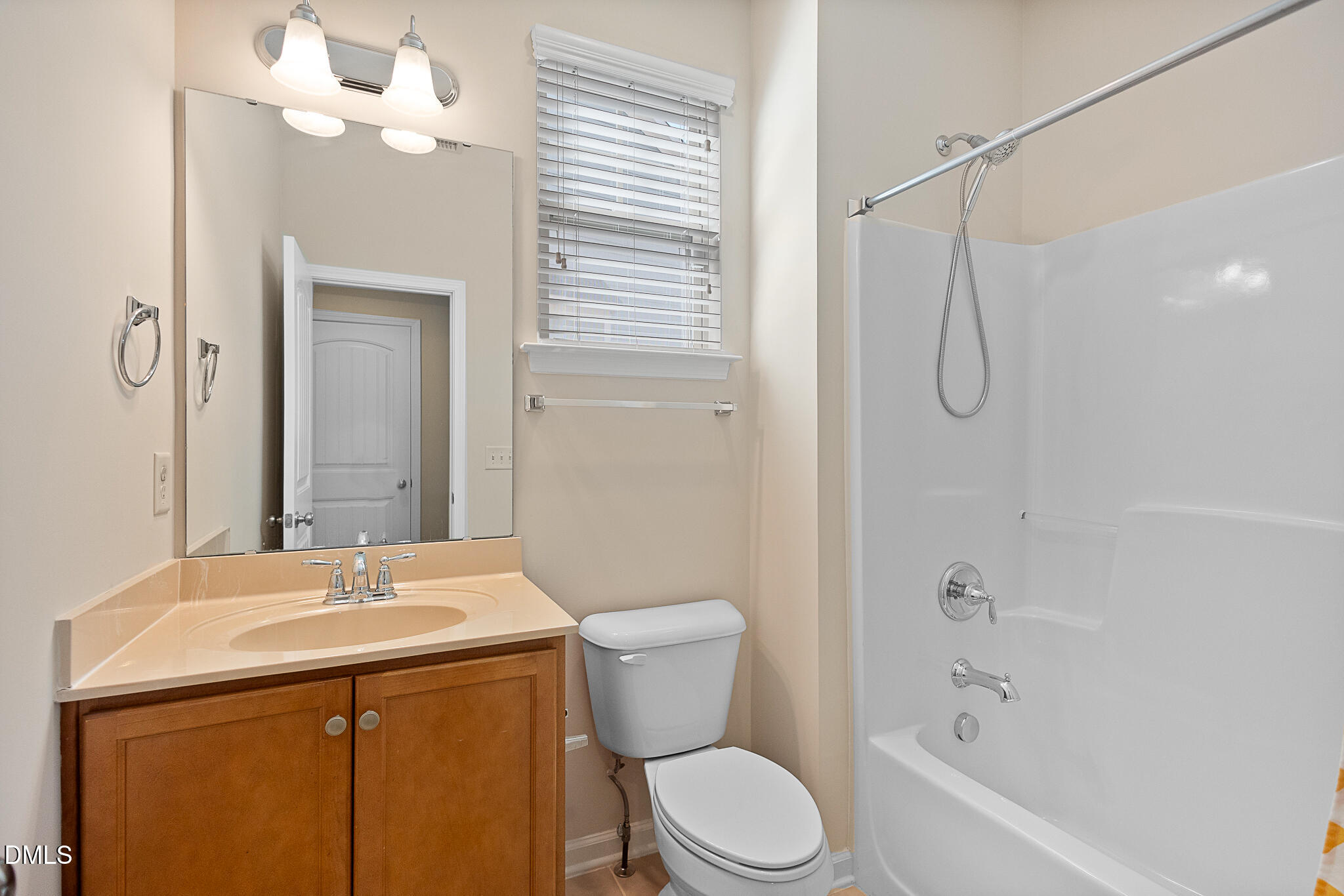 4249 Saubranch Hill Street Raleigh, NC 27616 - Photo 12 of 31 a bathroom with a sink a toilet and shower