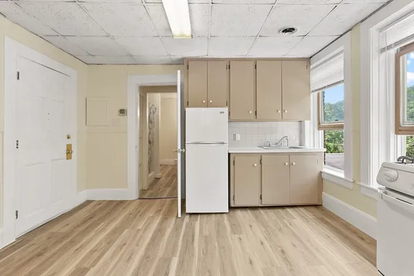 a view of kitchen with wooden floor