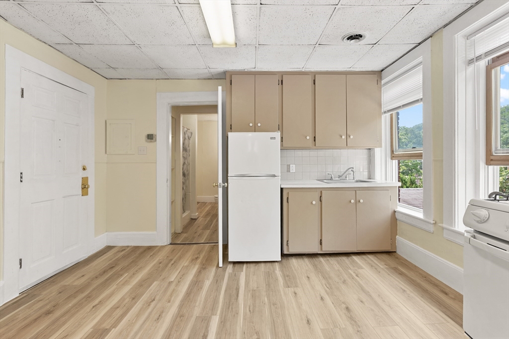 4 Davis Street Shirley, MA 01464 - Photo 12 of 18 a view of kitchen with wooden floor