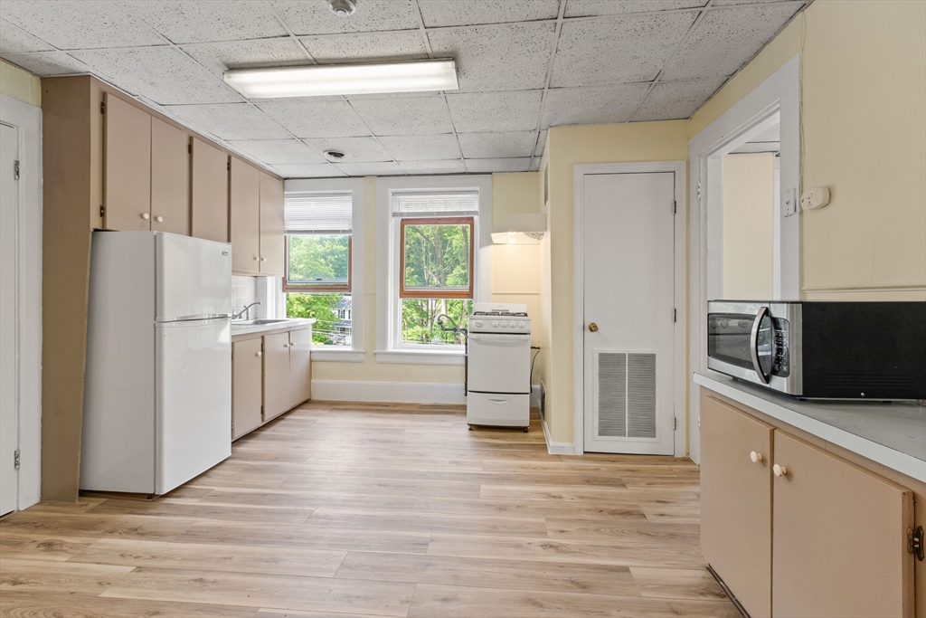4 Davis Street Shirley, MA 01464 - Photo 13 of 18 a kitchen with stainless steel appliances a refrigerator and a stove top oven