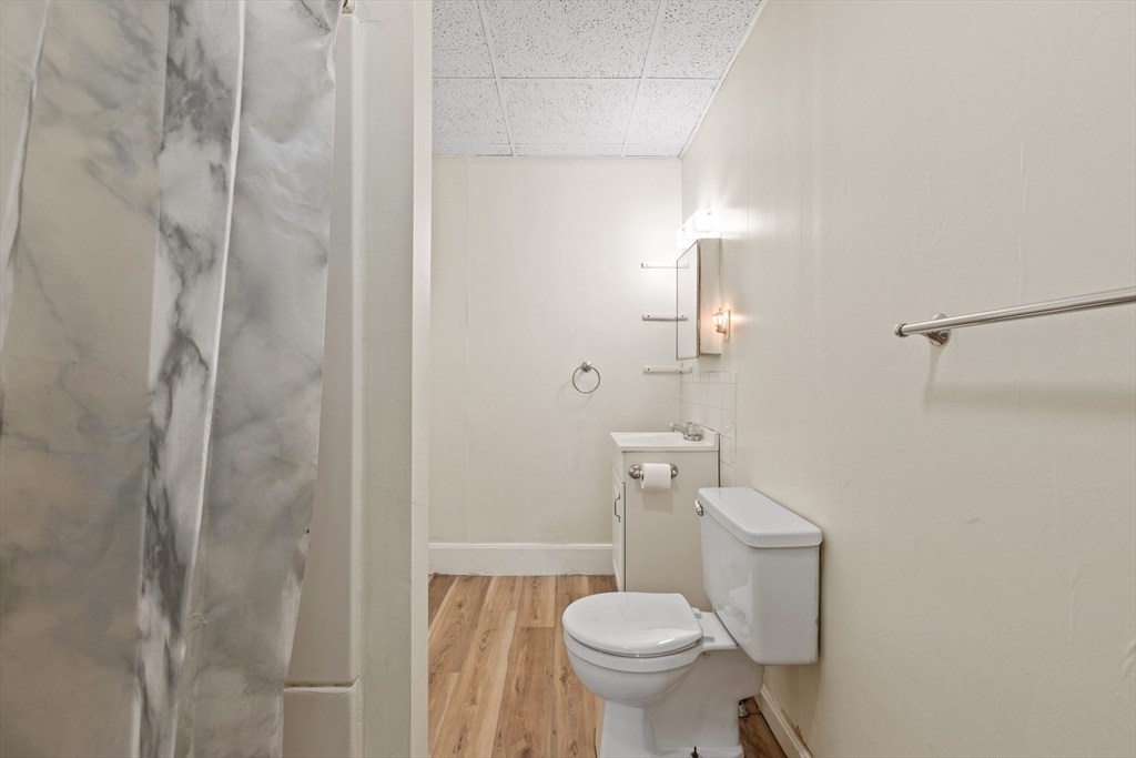 4 Davis Street Shirley, MA 01464 - Photo 16 of 18 a white toilet sitting next to a shower
