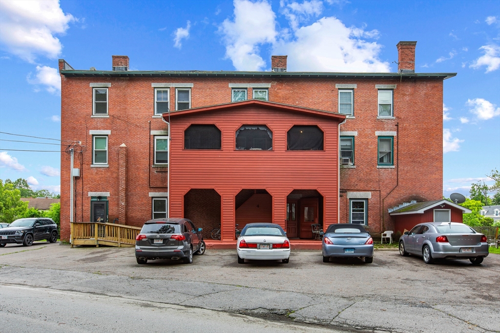 4 Davis Street Shirley, MA 01464 - Photo 2 of 18 a view of a car parked in front of a brick house