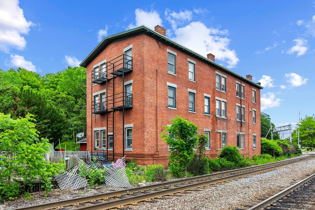 4 Davis Street Shirley, MA 01464 - Photo 4 of 18 a view of a large building