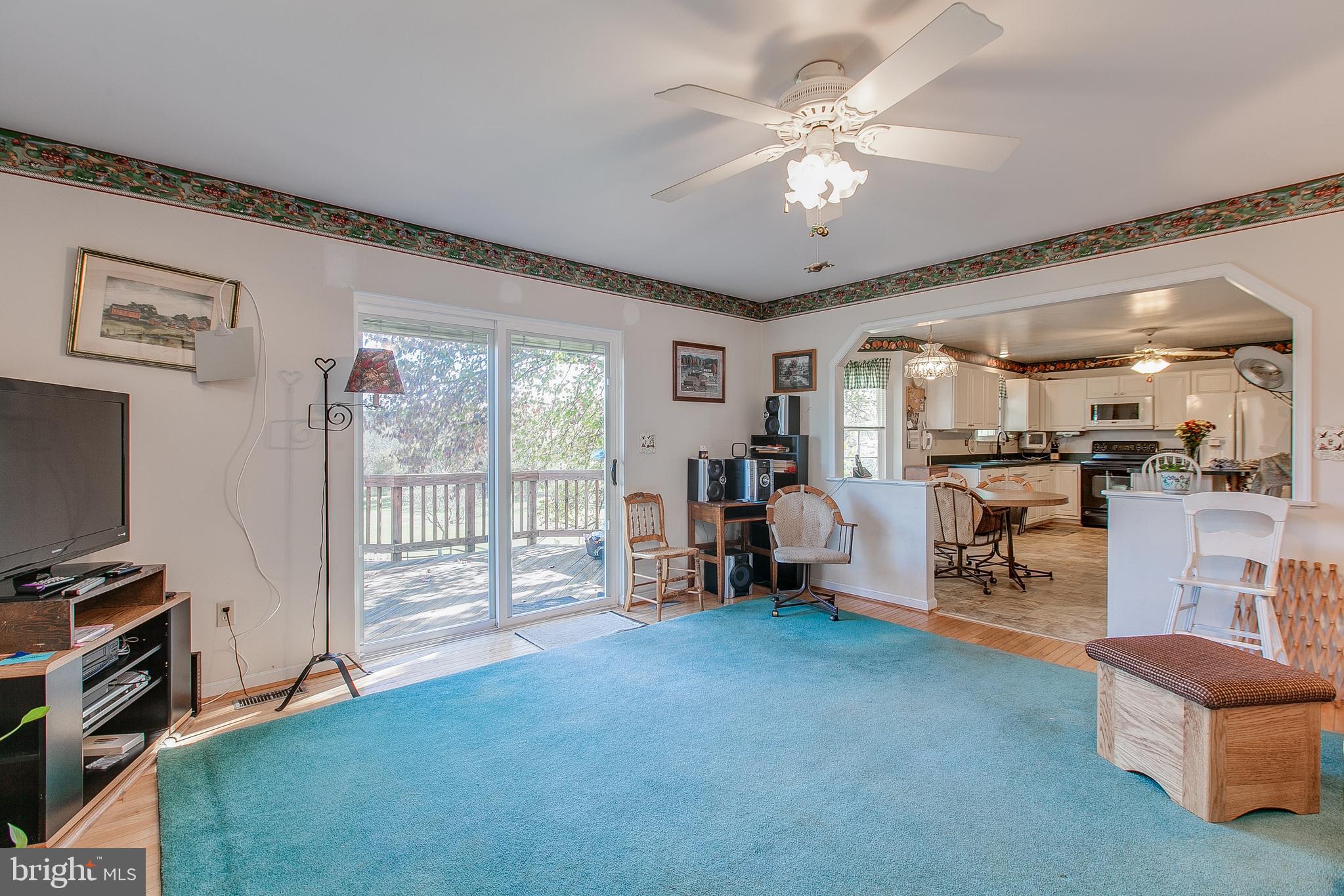 890 4 Seasons Road Westminster, MD 21157 - Photo 15 of 49 Family room with HW floors and fireplace