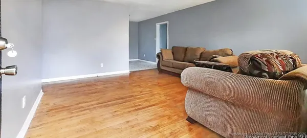 a living room with furniture and a couch