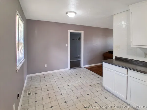 a bedroom with a large bed and a walk in closet