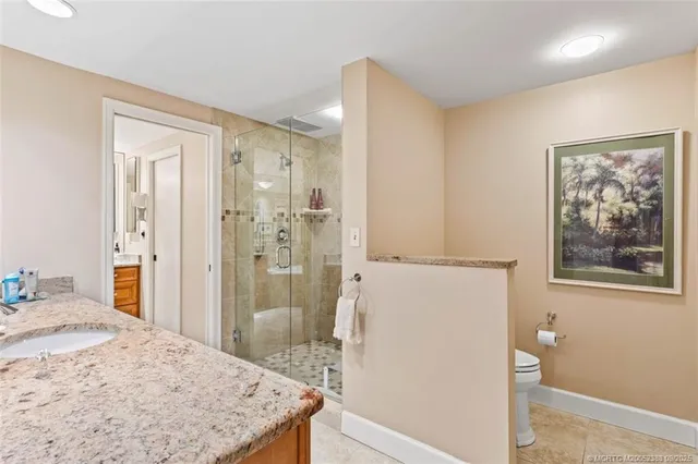 a spacious bathroom with a tub sink and mirror