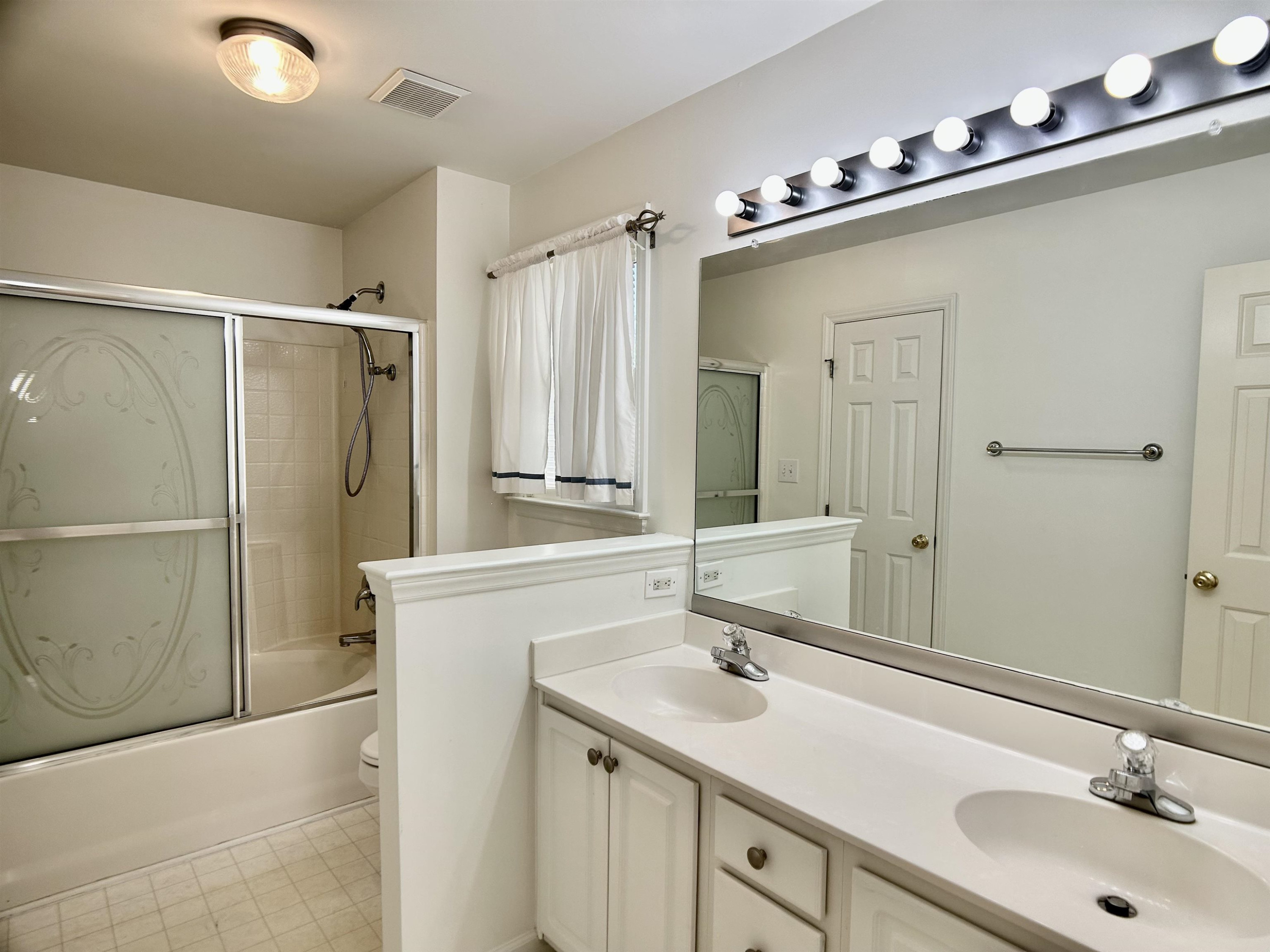 1931 Ranch Road Clayton, NC 27520 - Photo 13 of 34 a bathroom with a sink double vanity and a mirror