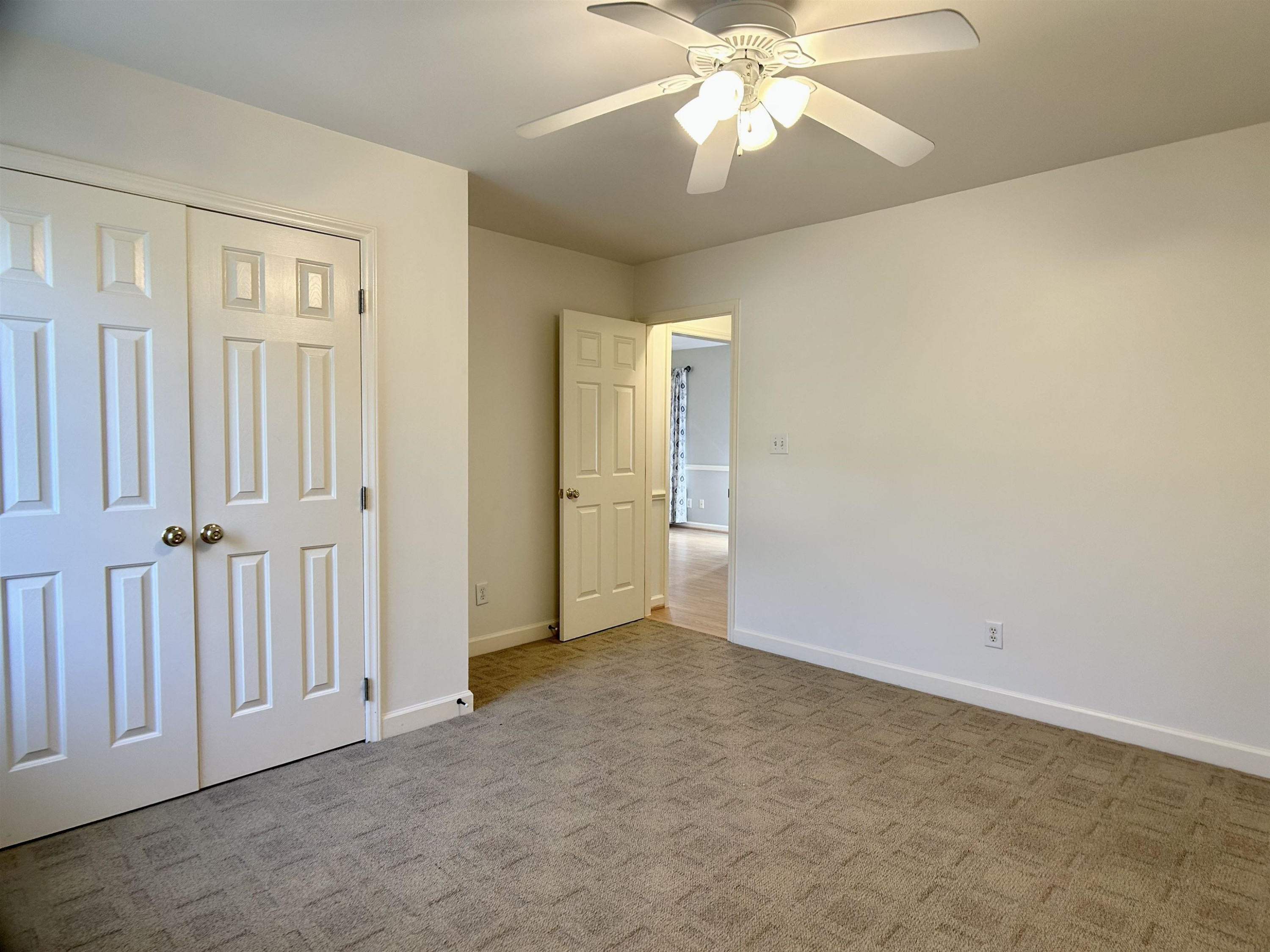 1931 Ranch Road Clayton, NC 27520 - Photo 15 of 34 an empty room with fan and entrance