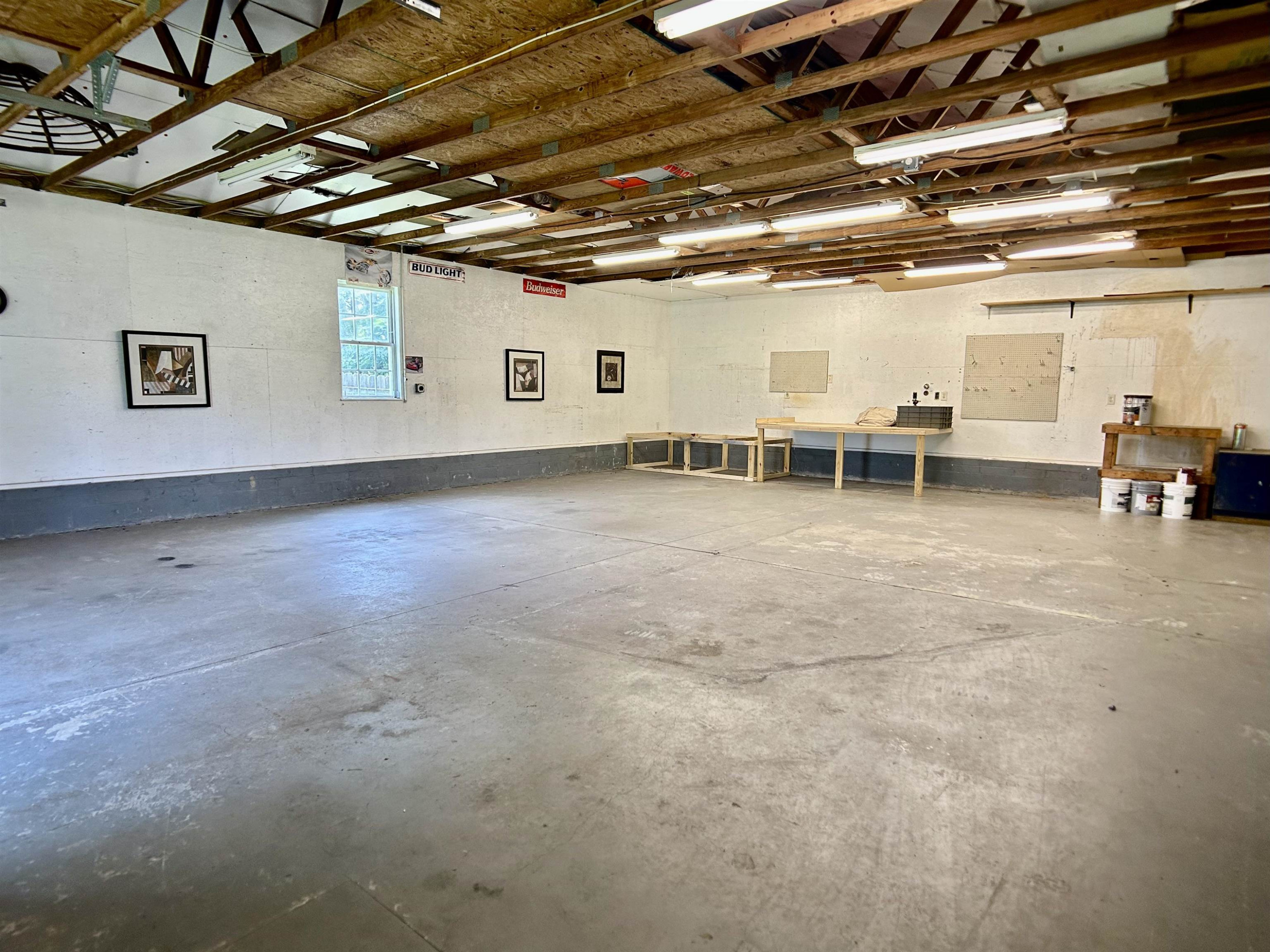 1931 Ranch Road Clayton, NC 27520 - Photo 26 of 34 a view of a big room with wooden walls