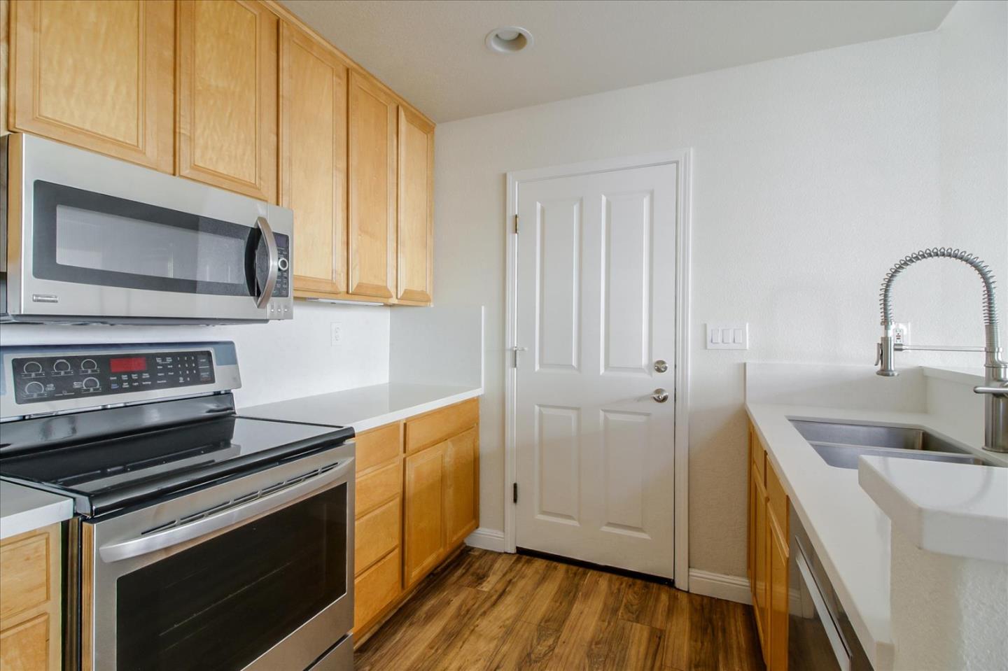 82 Cannery Circle Campbell, CA 95008 - Photo 13 of 35 a kitchen with a sink stove and microwave