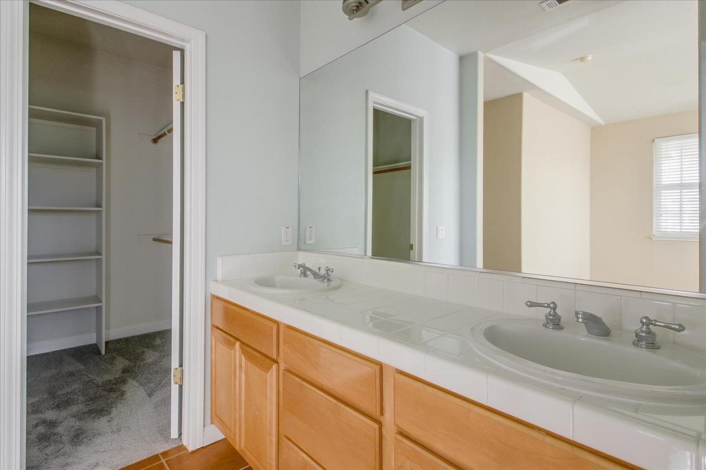 82 Cannery Circle Campbell, CA 95008 - Photo 23 of 35 a bathroom with a sink and a mirror