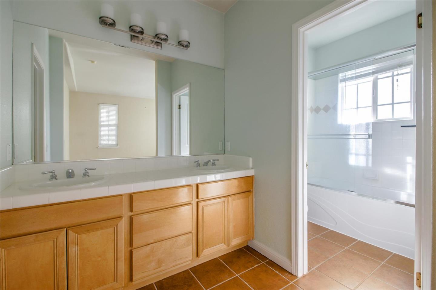 82 Cannery Circle Campbell, CA 95008 - Photo 24 of 35 a bathroom with a double vanity sink and a mirror