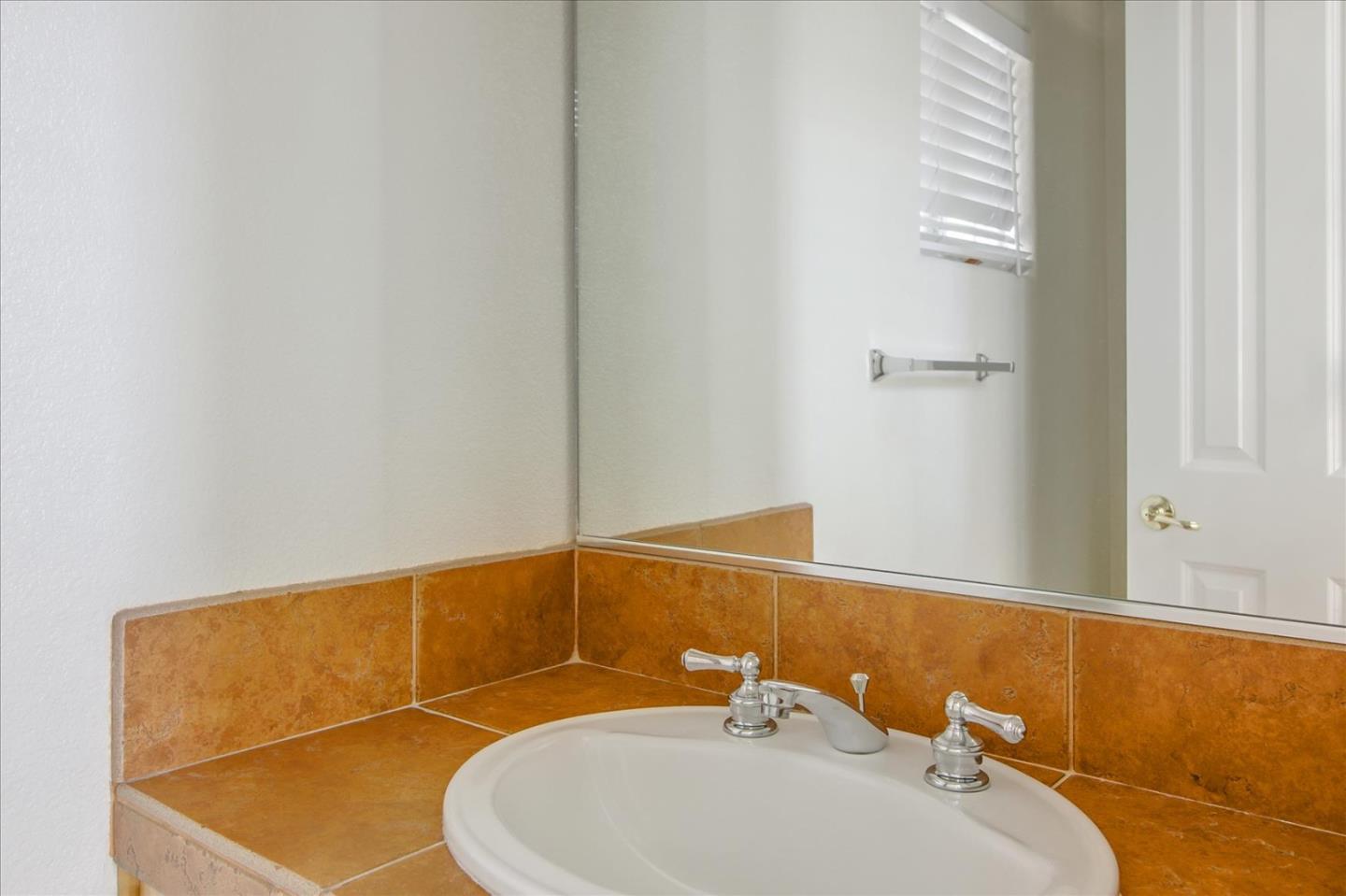 82 Cannery Circle Campbell, CA 95008 - Photo 26 of 35 a bathroom with a sink and a mirror