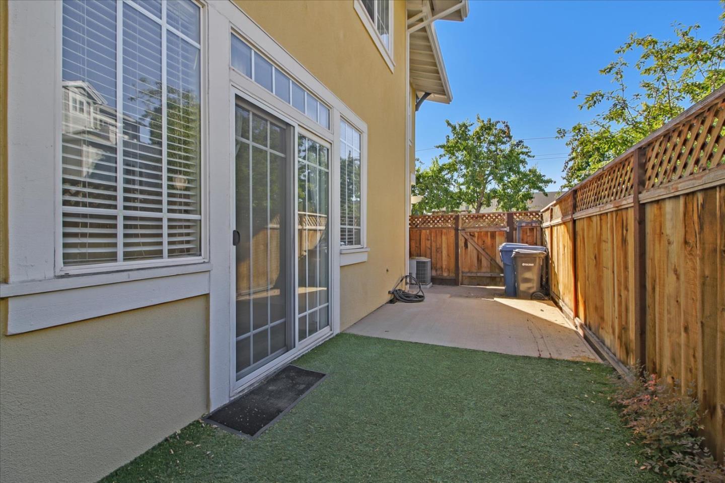 82 Cannery Circle Campbell, CA 95008 - Photo 30 of 35 a view of a backyard with plants and large tree