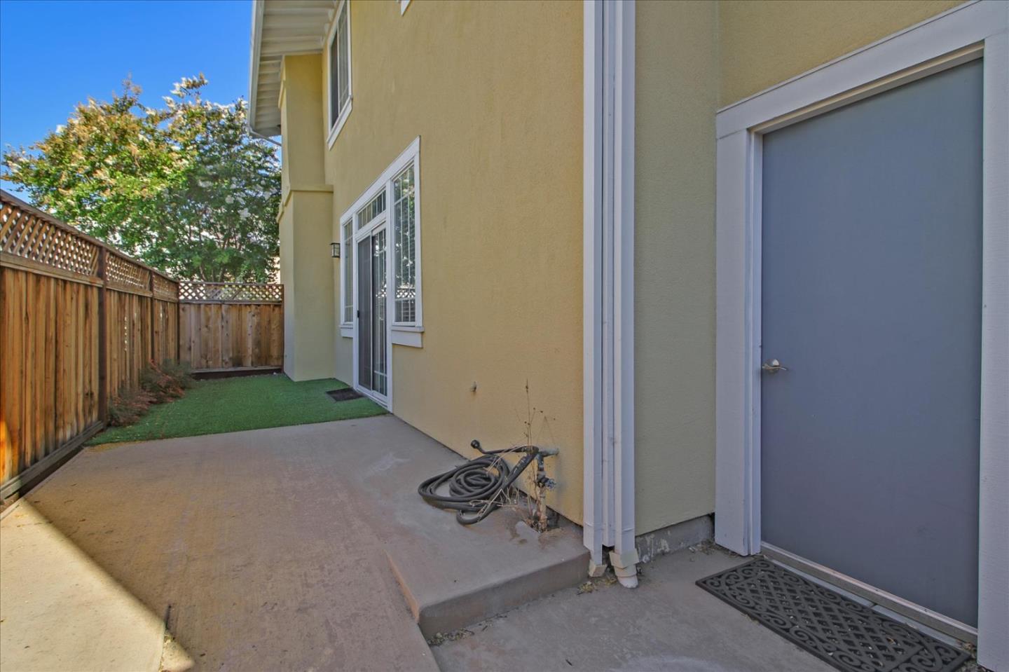 82 Cannery Circle Campbell, CA 95008 - Photo 32 of 35 a view of a backyard with brick wall and potted plants