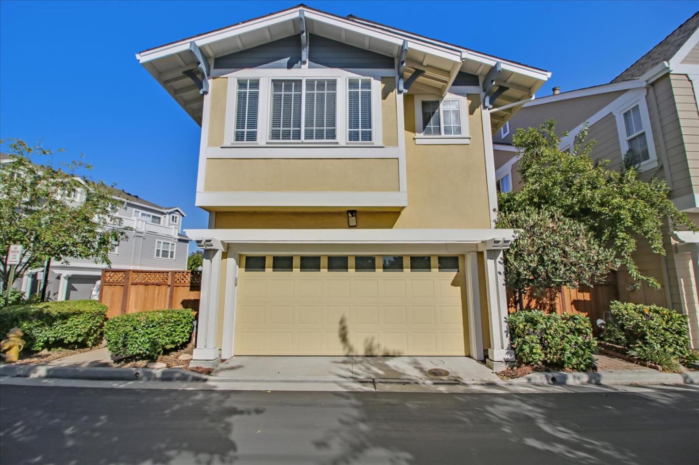 82 Cannery Circle Campbell, CA 95008 - Photo 34 of 35 a front view of a house with a yard and garage