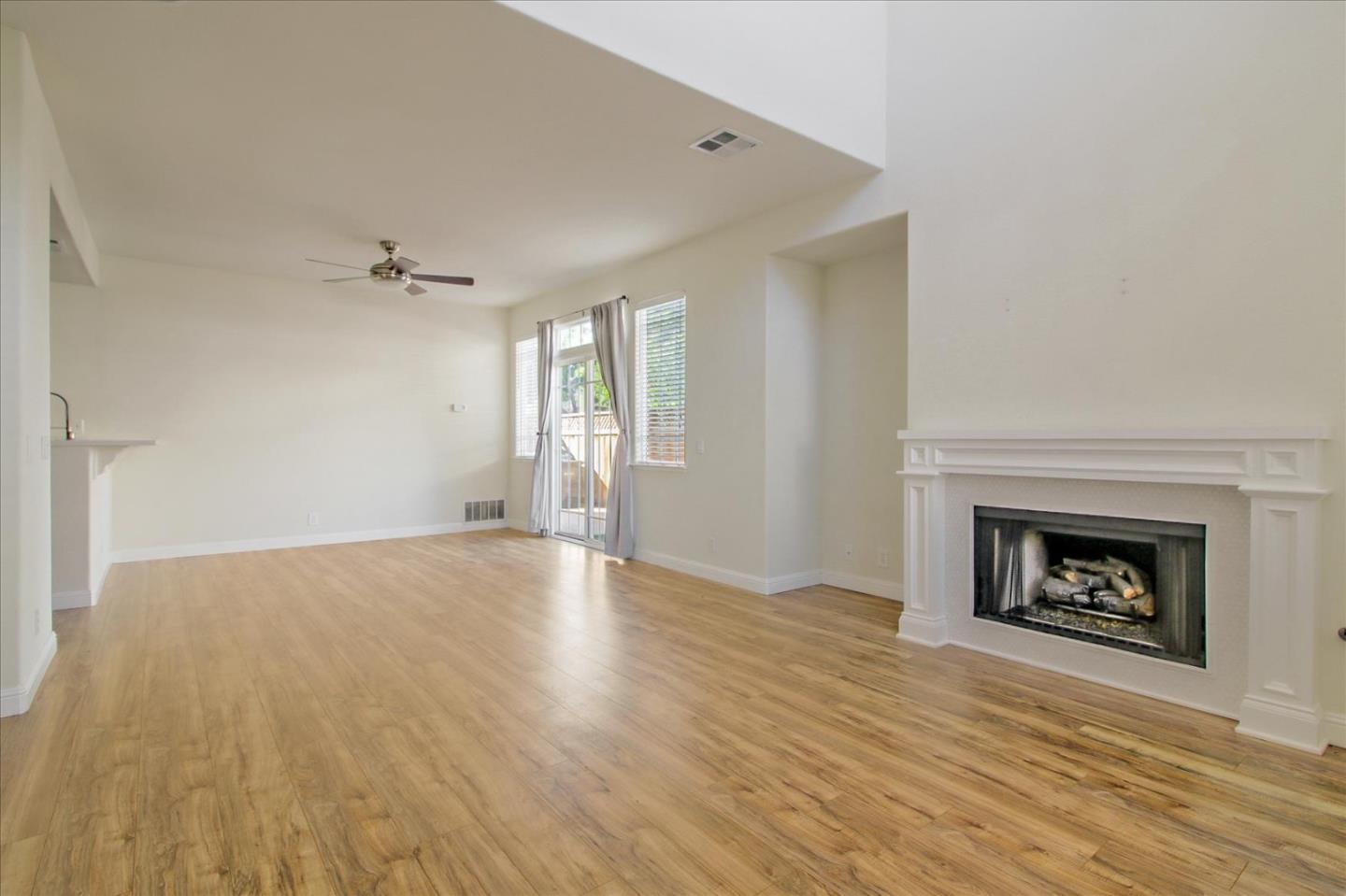 82 Cannery Circle Campbell, CA 95008 - Photo 6 of 35 an empty room with windows and fireplace