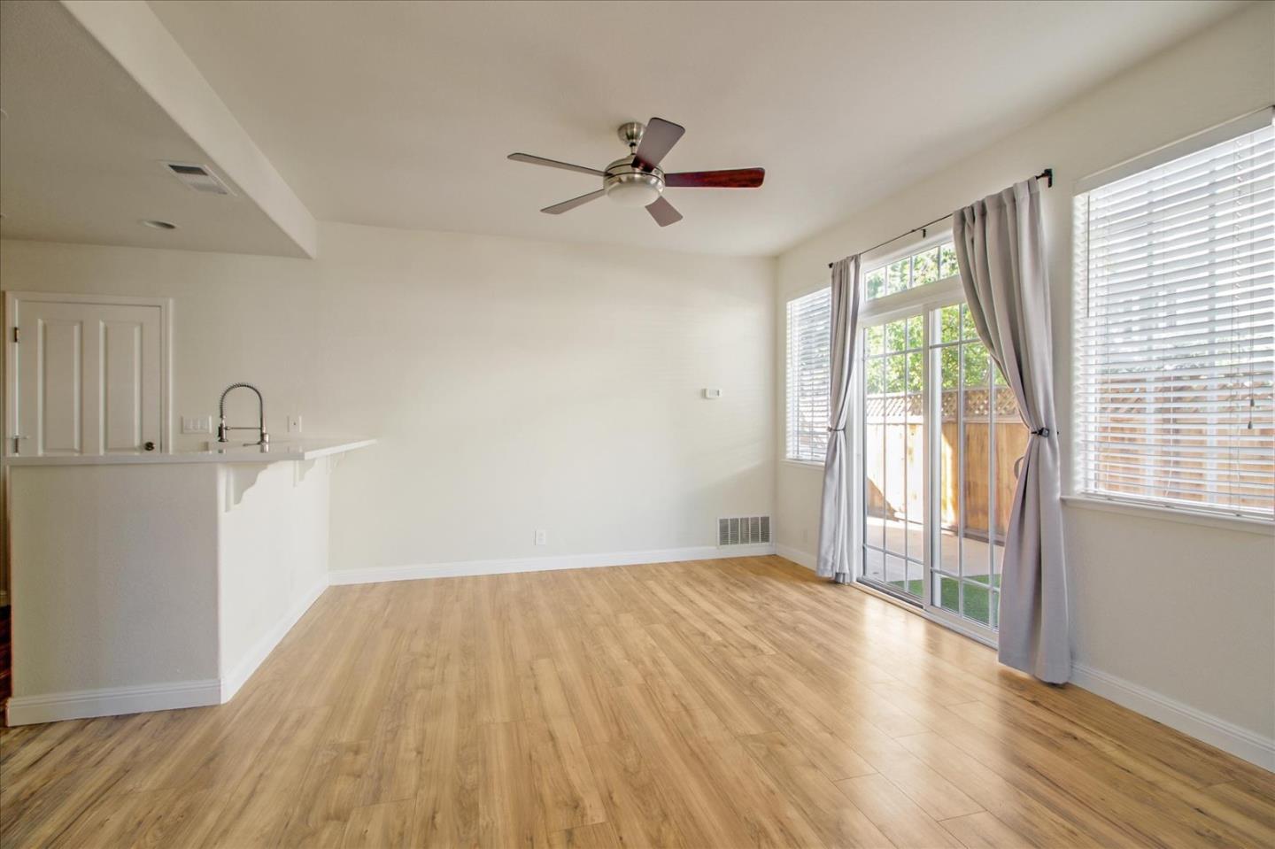 82 Cannery Circle Campbell, CA 95008 - Photo 8 of 35 a view of empty room with wooden floor and fan