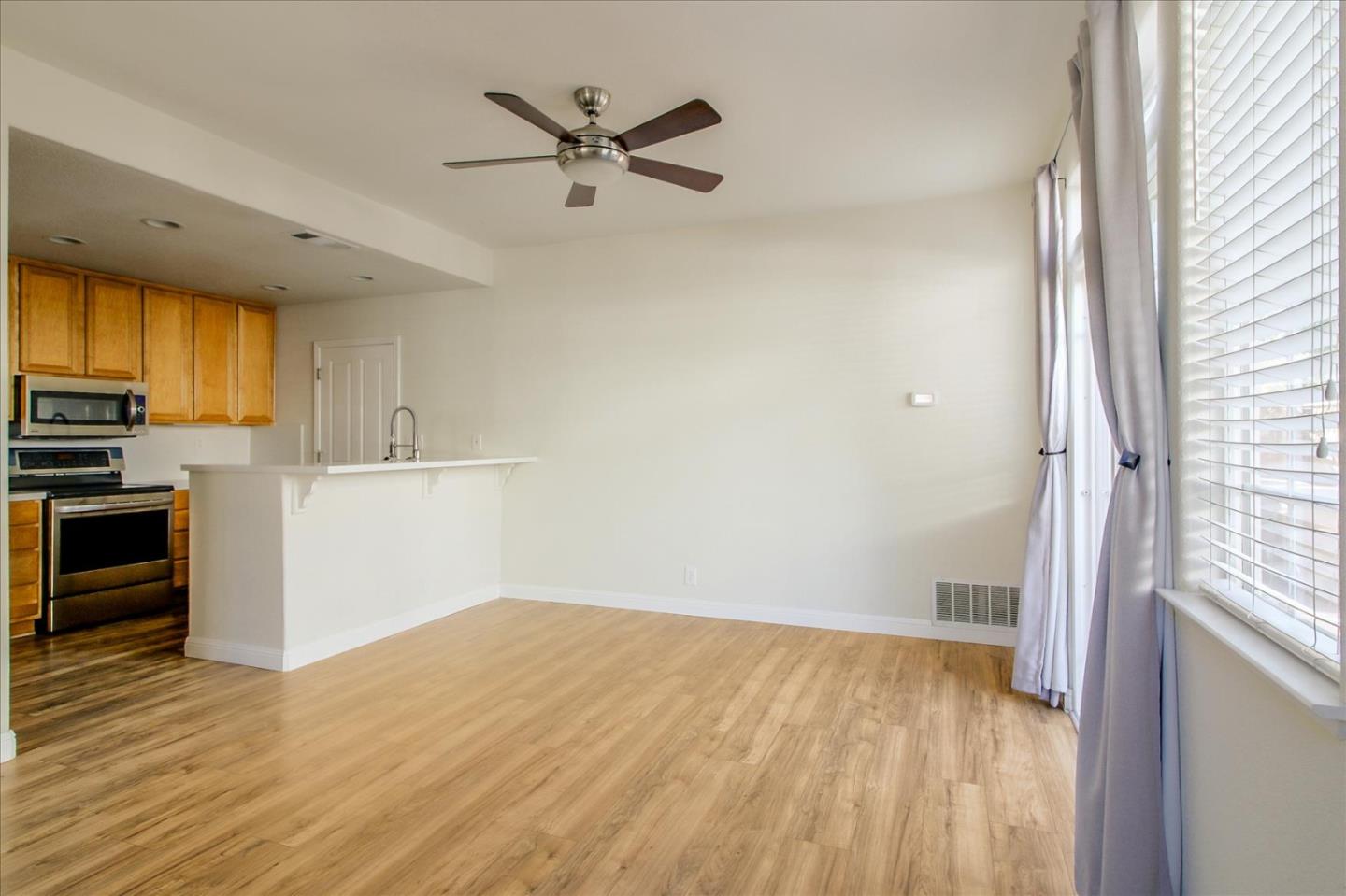 82 Cannery Circle Campbell, CA 95008 - Photo 9 of 35 a view of a kitchen with a sink dishwasher and wooden floor