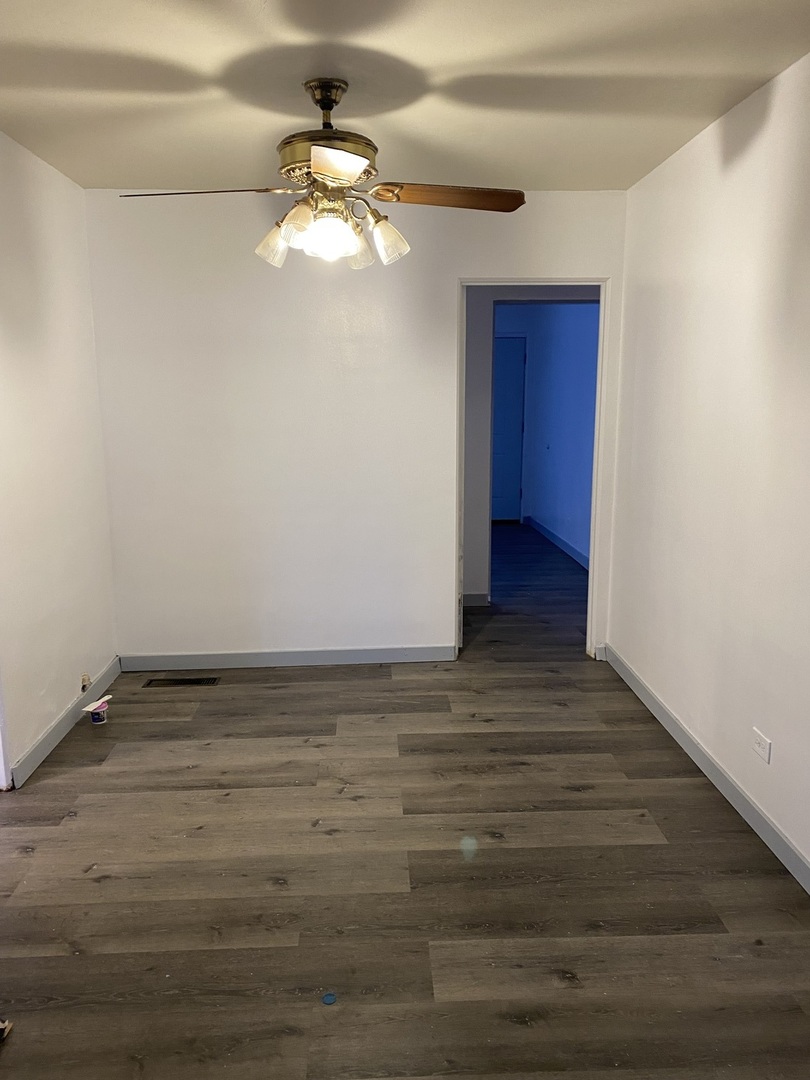 17218 Park Avenue Lansing, IL 60438 - Photo 7 of 19 a view of an empty room with wooden floor