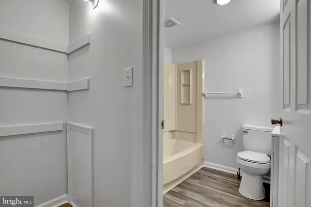 a bathroom with a bathtub and toilet