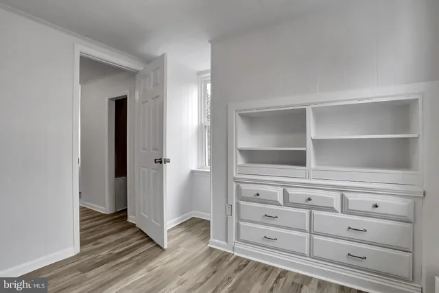 a view of a dresser with wooden floor