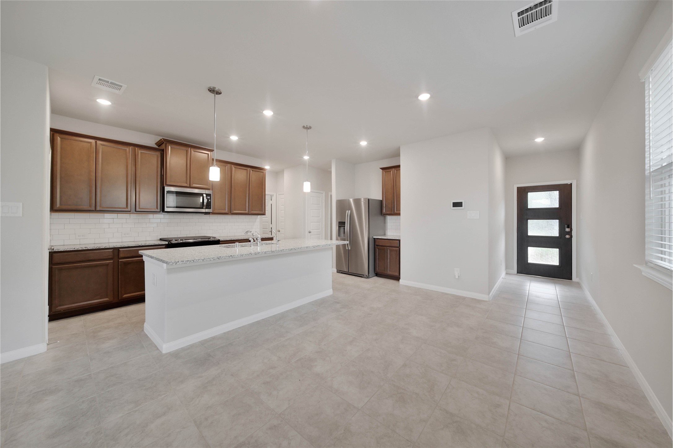 7080 Silverleaf Oak Street Conroe, TX 77304 - Photo 33 of 35 Step inside and appreciate the great natural light and open-concept floorplan that is perfect for seamless entertaining and easy family living.